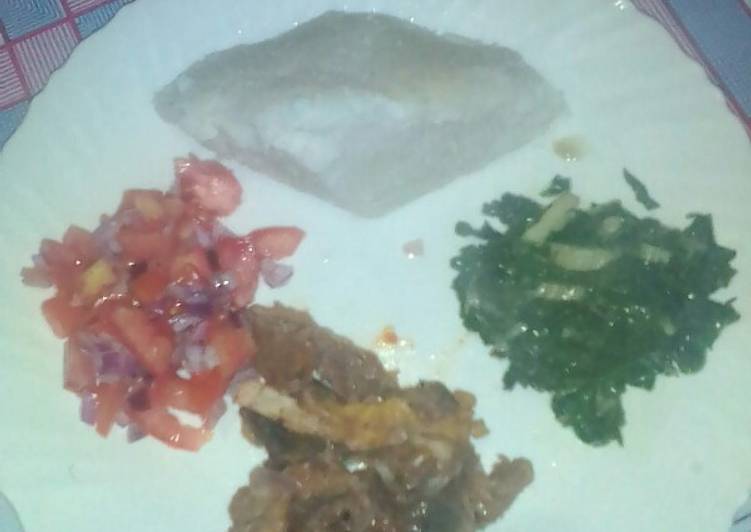 Ugali,, beef and steamed spinanch