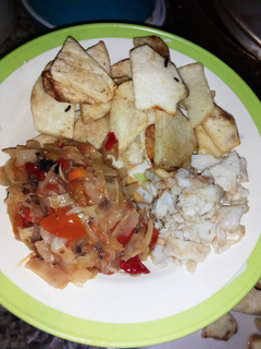 A picture of Fry yam, scrambled egg and cabbage sauce.