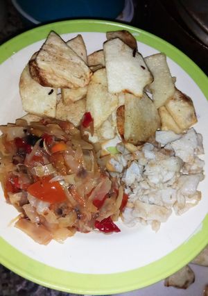 A picture of Fry yam, scrambled egg and cabbage sauce.