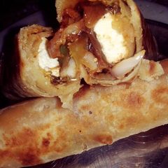 A picture of Spicy Veg Paneer Roll. Loaded with mix veggies.
