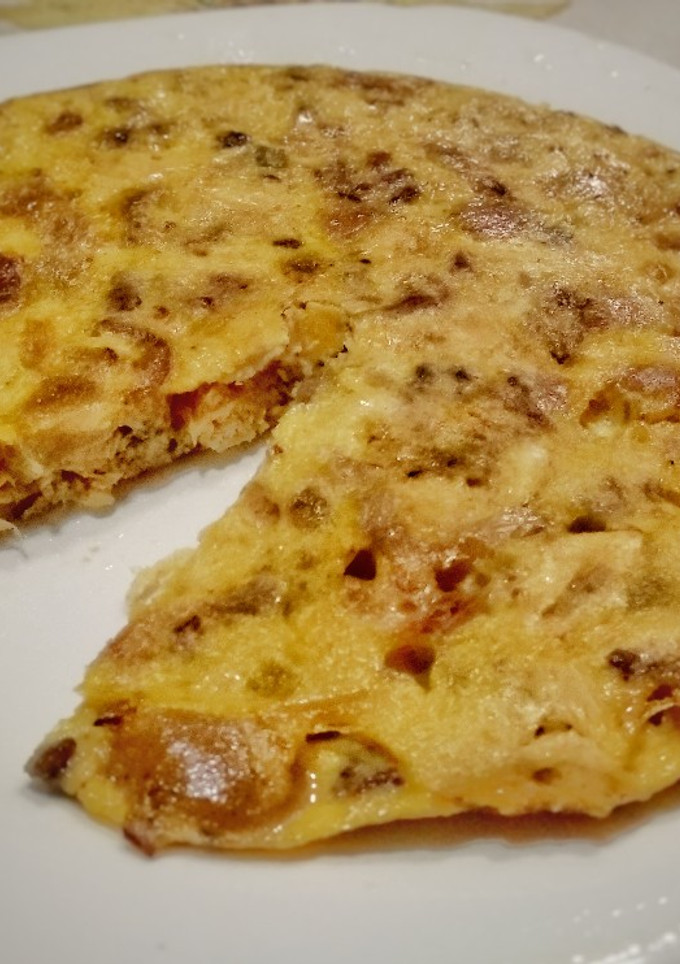 Una foto de Tortilla de codillo y pollo