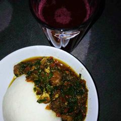 A picture of Pounded yam wit vegetable soup nd zobo drink.