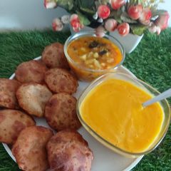 A picture of Amaranth Flour(rajgiriatta) Poori with Potato Veg, with Mango Rass.