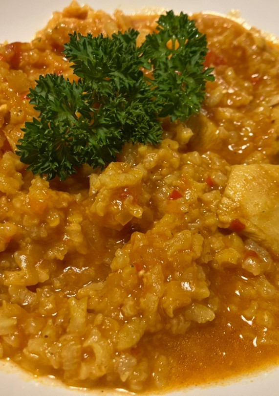 Una foto de Arroz caldoso con pollo
