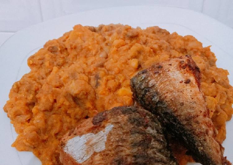 Soft delicious beans and plantains with fried spicy Titus fish