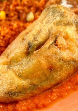 A picture of Chiles Rellenos with Meat and Almonds.