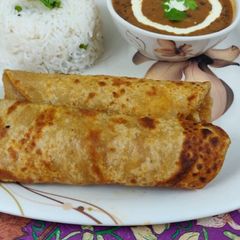 A picture of Daal chawal and paratha.