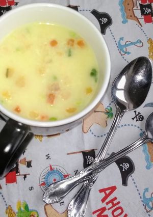 A picture of Vegetable sweet corn soup with croutons.