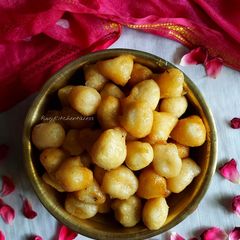 A picture of Mitha bara / sweet lentil fritters.