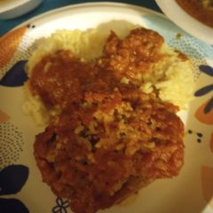 A picture of Stuffed Bell Peppers served with Rice 2023.