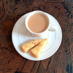 A picture of Tea time, with homemade cake.