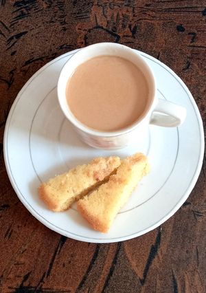 A picture of Tea time, with homemade cake.