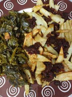Una foto de Morcilla con patatas y berza al ajillo