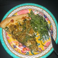 A picture of Pesto Chicken Pizza with Arugula Side Salad.