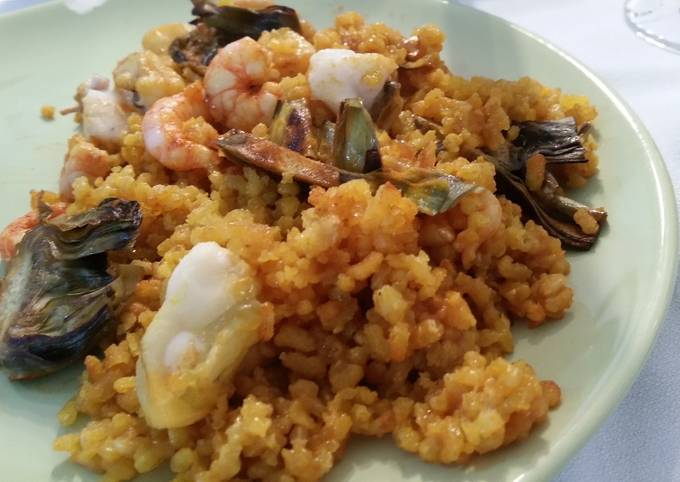 Seafood paella with artichokes