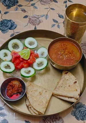 A picture of 🌿 Garlic Green Moong Dal Thali.