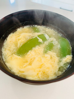 A picture of Egg drop miso soup with snap-pea.