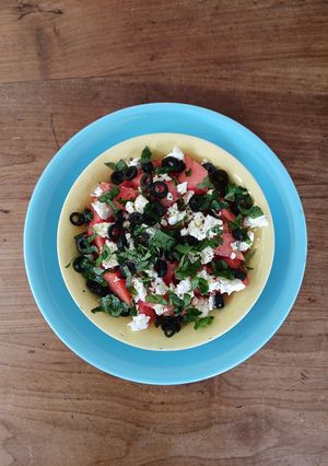 A picture of Watermelon feta salad with basil mint.
