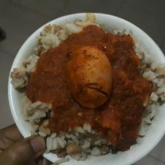A picture of Rice and beans with egg.