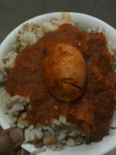 A picture of Rice and beans with egg.