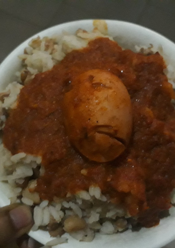 A picture of Rice and beans with egg.