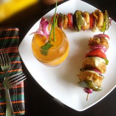 A picture of Chutney bomb tikki with spicy creamy coconut sauce.