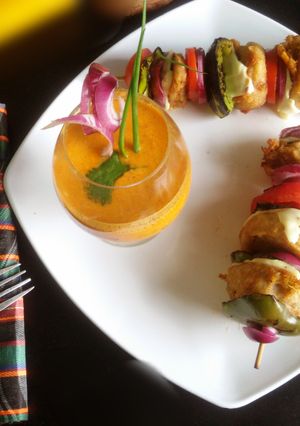 A picture of Chutney bomb tikki with spicy creamy coconut sauce.