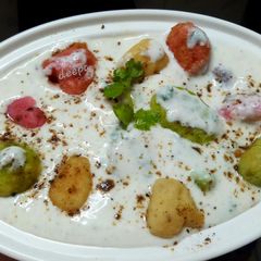 A picture of Colourful angoori raita.