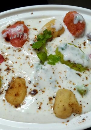 A picture of Colourful angoori raita.