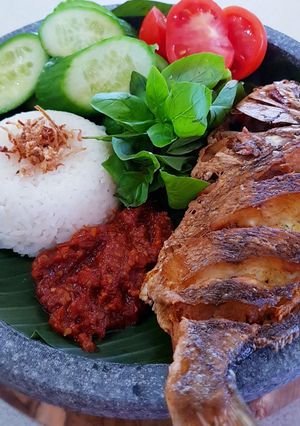 A picture of IKAN GORENG SAMBAL TRASI LALAPAN (Fried Fish with Sambal, Veg).