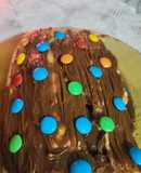 Pionono dulce con dulce de leche y chocolates confitados