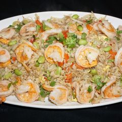 A picture of Shrimp fried brown rice with edamame beans.