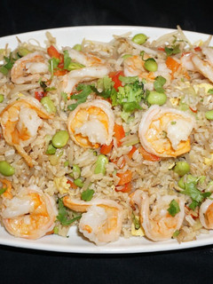 A picture of Shrimp fried brown rice with edamame beans.