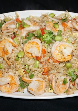 A picture of Shrimp fried brown rice with edamame beans.