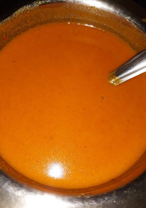 A picture of Tomato, cauliflower, carrot, potato soup.
