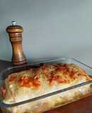 Lasagna de pollo con panceta y masa de pasta gratinada al horno