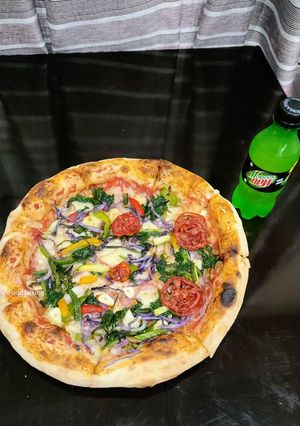 A picture of Baby Spinach Pan Pizza.