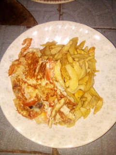A picture of Chips with fried egg.