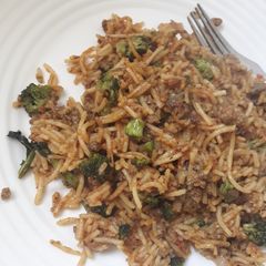 A picture of Left over brocolli with spaghetti.