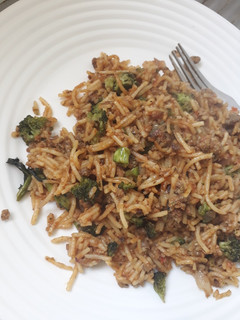 A picture of Left over brocolli with spaghetti.
