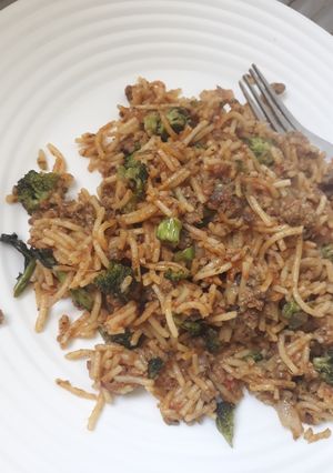 A picture of Left over brocolli with spaghetti.