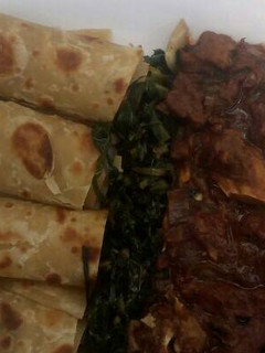 A picture of Beef stew,greens with chapati.