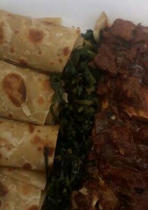 A picture of Beef stew,greens with chapati.