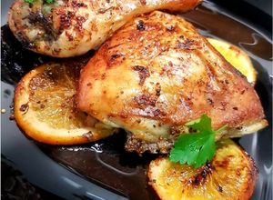 Foto principal de Muslos de pollo asados con naranja y vino de jerez