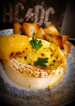 A picture of Baked Camembert with Leek Fondue and Crispy Parsley Brick Dippers.