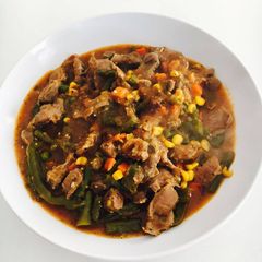 A picture of Chicken gizzard and mixed vegetables stew.