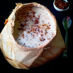 A picture of Tender Coconut Kheer with Coconut Crumbs.