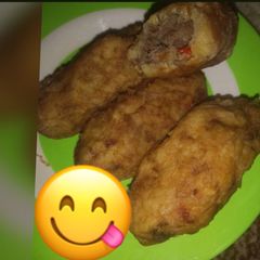 A picture of Irish potatoes with minced meat.