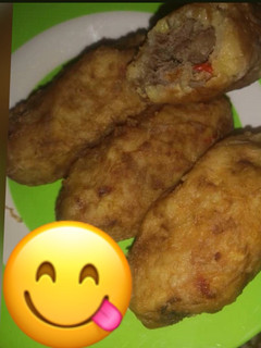 A picture of Irish potatoes with minced meat.