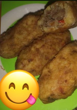 A picture of Irish potatoes with minced meat.